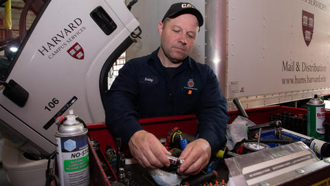 Auto mechanic working with tools