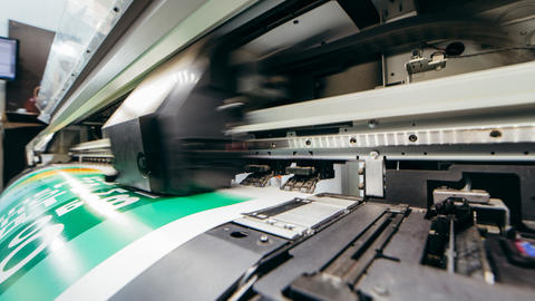 poster being printed on large format printer