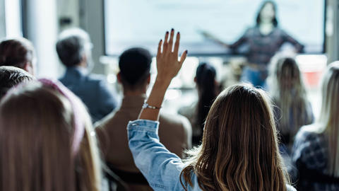 Audience raising their hands