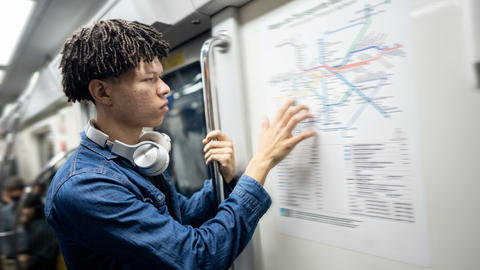 Person looking at a transit map