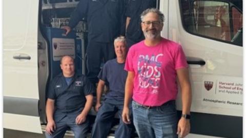 Fleet mechanics with their outfitted van
