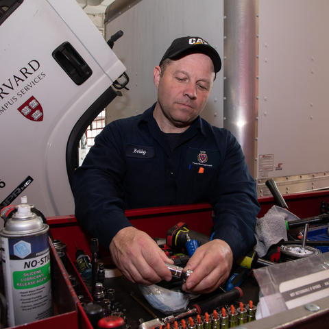 Auto mechanic working with tools