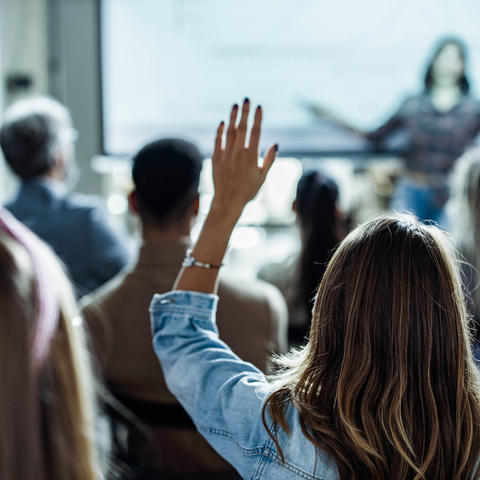 Audience raising their hands