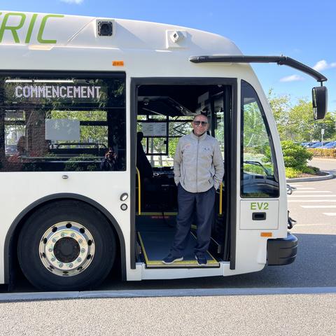 Shuttle operator welcoming riders
