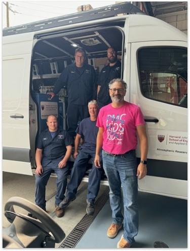 Fleet mechanics with their outfitted van