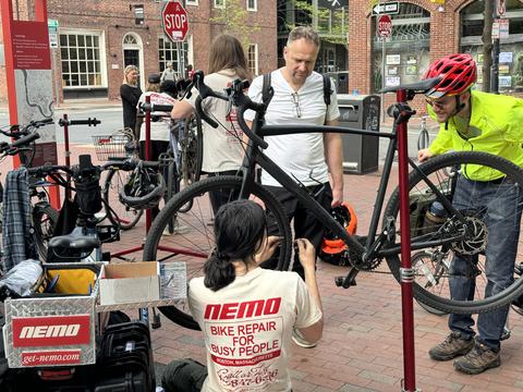 Person fixing a bicycle